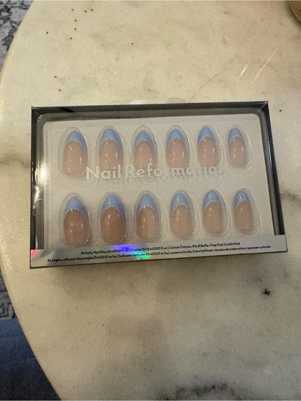 Reformation Nude Oval Press-On Nails with Light Blue French Tips